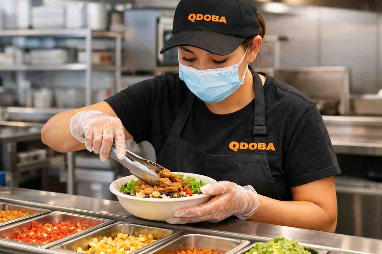 Qdoba Employee Preparing Fresh Ingredients