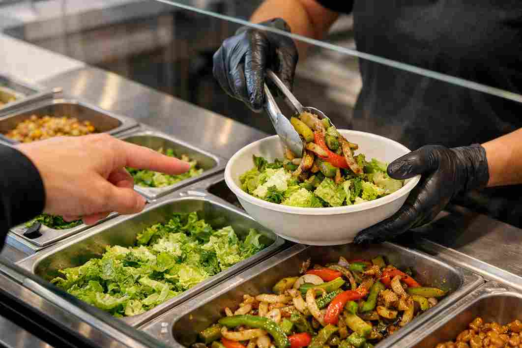 Ordering fresh ingredients at Qdoba